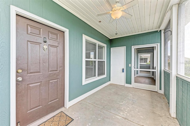 entrance to property with ceiling fan