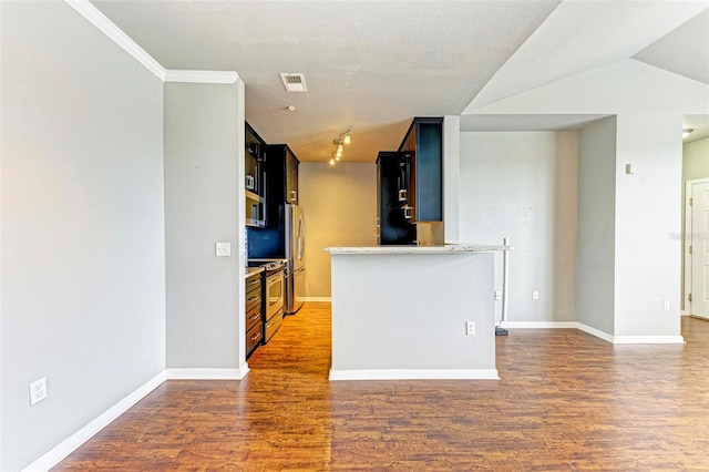 kitchen featuring stainless steel appliances, dark wood-type flooring, visible vents, and baseboards