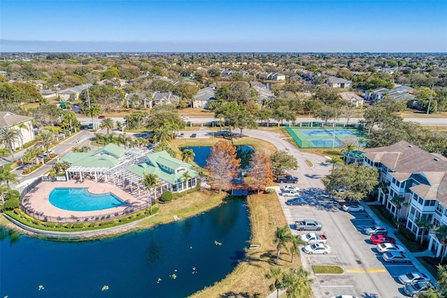 drone / aerial view featuring a water view and a residential view