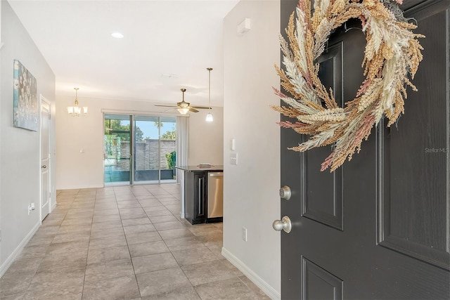 interior space featuring light tile patterned flooring and an inviting chandelier