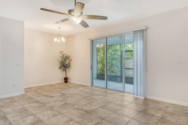 tiled spare room with ceiling fan with notable chandelier