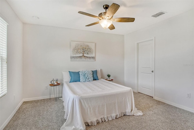 bedroom featuring ceiling fan and light colored carpet