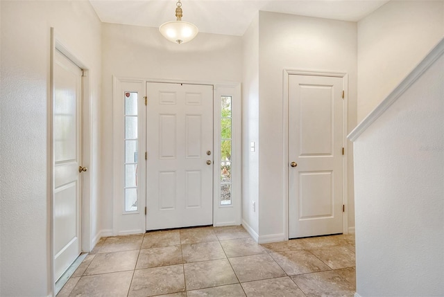 entrance foyer featuring light tile patterned flooring