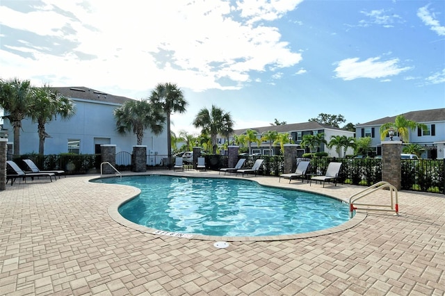 view of swimming pool featuring a patio area