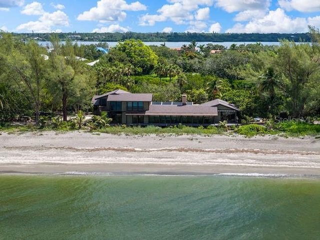 aerial view featuring a view of the beach and a water view