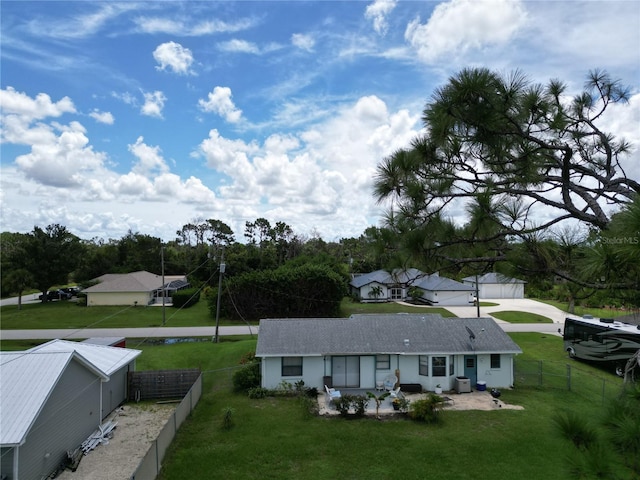 rear view of house featuring a lawn