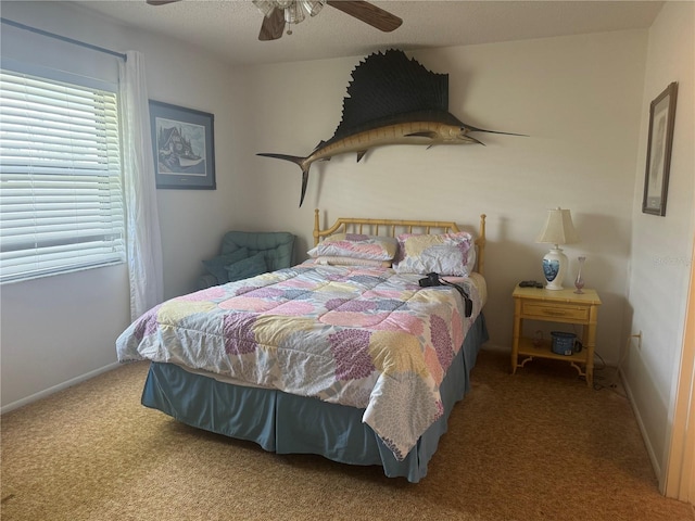 bedroom featuring ceiling fan and carpet floors