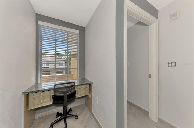 office area featuring baseboards