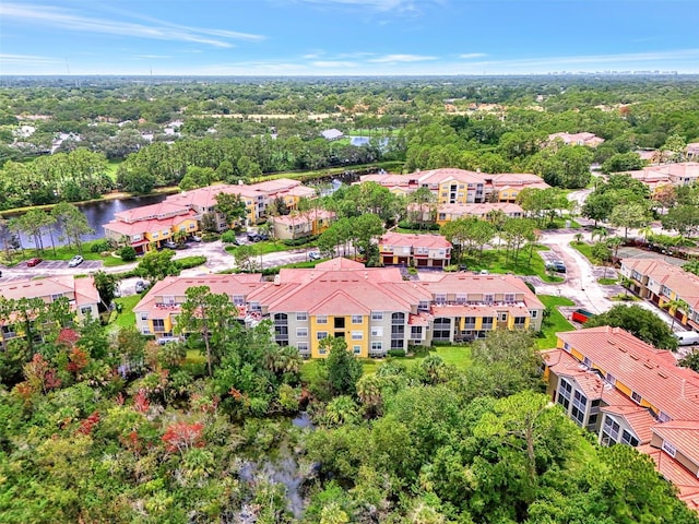 birds eye view of property featuring a residential view and a water view