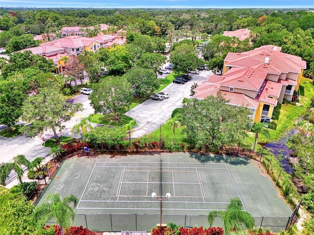 drone / aerial view featuring a wooded view