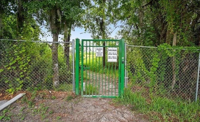 view of gate featuring fence