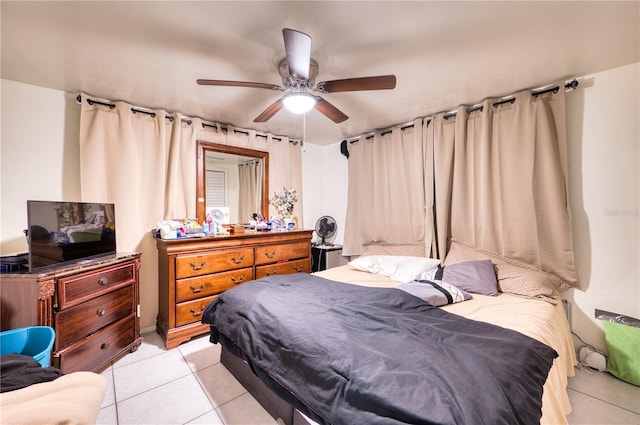 tiled bedroom with ceiling fan