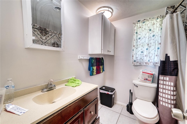 bathroom with tile patterned floors, toilet, vanity, and curtained shower