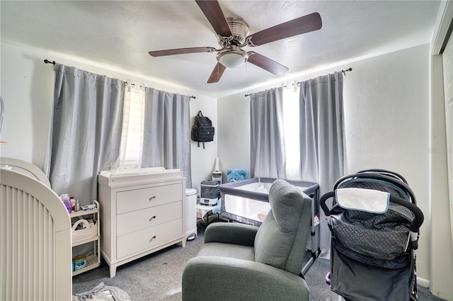 bedroom with ceiling fan and carpet