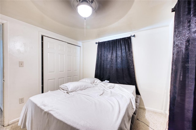 bedroom featuring ceiling fan and a closet