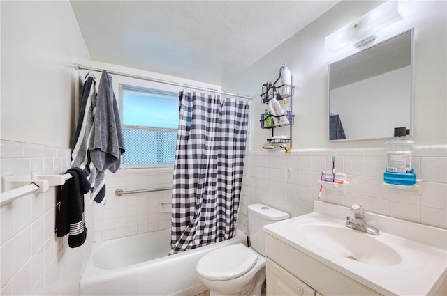 full bathroom featuring tile walls, backsplash, vanity, and toilet