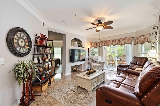 living room with baseboards, ceiling fan, visible vents, and crown molding