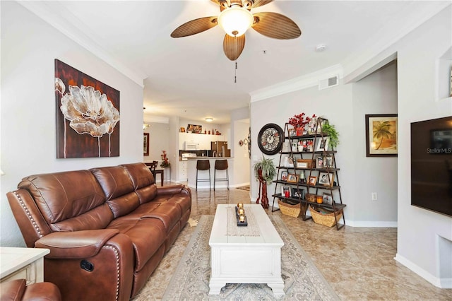 living room featuring visible vents, crown molding, baseboards, and ceiling fan