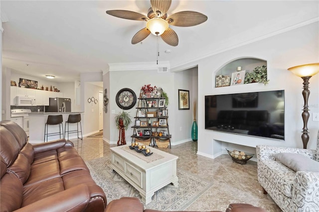 living room featuring ceiling fan, crown molding, and light tile patterned floors