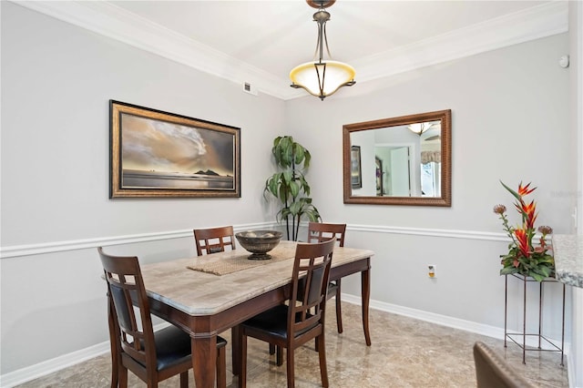 dining area with baseboards, visible vents, and crown molding