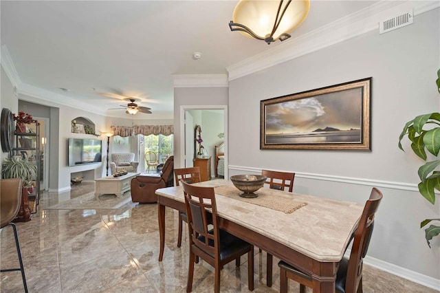 dining area featuring ceiling fan, visible vents, baseboards, marble finish floor, and crown molding