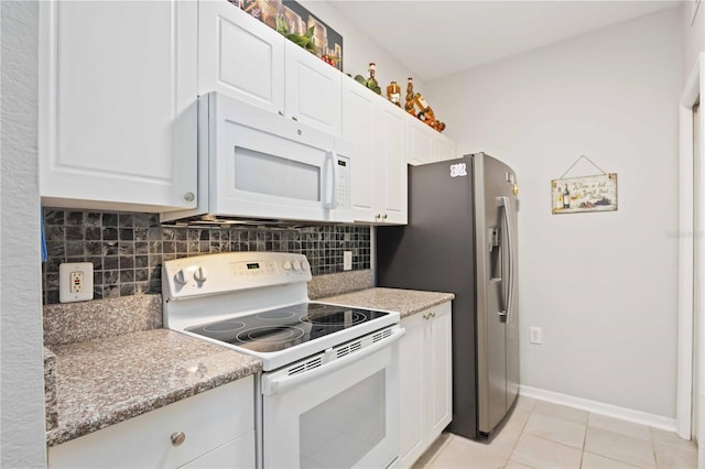 kitchen with white cabinets, tasteful backsplash, white appliances, and light tile patterned floors