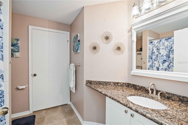 bathroom featuring tile patterned floors and vanity