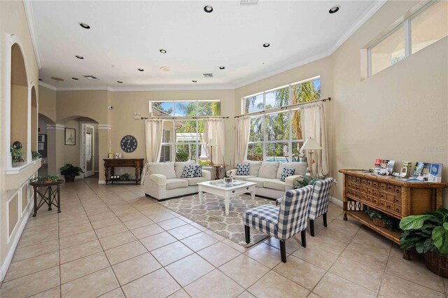 living room featuring light tile patterned flooring and ornamental molding