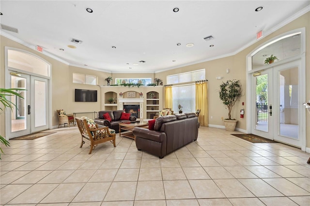 living room featuring french doors, crown molding, and light tile patterned flooring