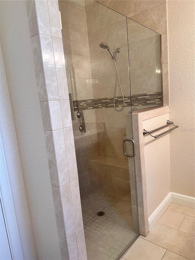 bathroom with a shower with shower door