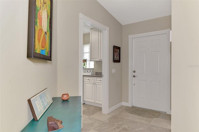 foyer entrance with baseboards