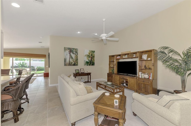 tiled living room with lofted ceiling and ceiling fan