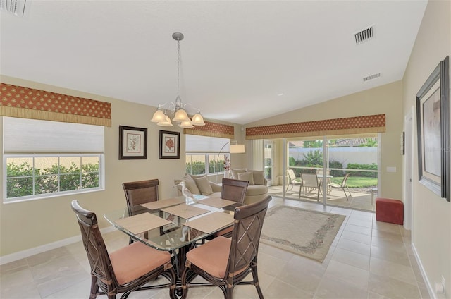 dining room with lofted ceiling, light tile patterned floors, and plenty of natural light