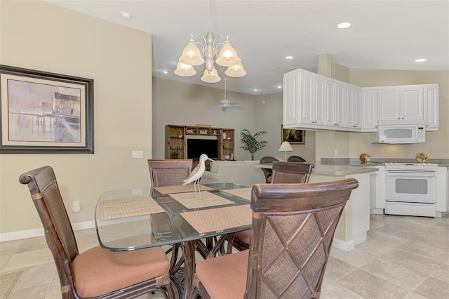 tiled dining area featuring ceiling fan with notable chandelier