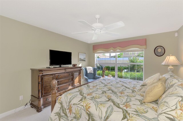 bedroom with a ceiling fan, light carpet, and baseboards