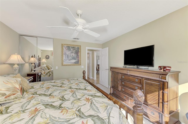 bedroom with wood-type flooring, ceiling fan, and a closet