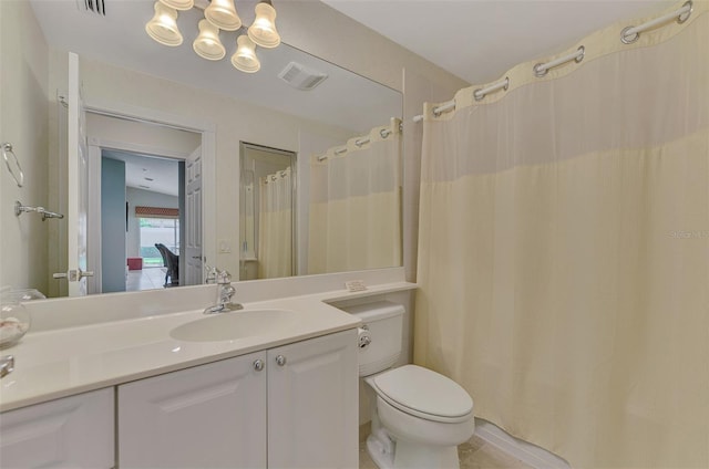 full bathroom featuring visible vents, vanity, and toilet