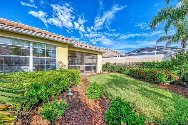 view of yard featuring a sunroom