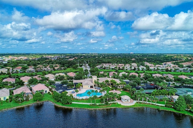 drone / aerial view with a water view and a residential view