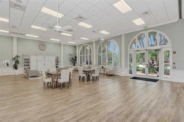 dining space with ceiling fan, plenty of natural light, and french doors