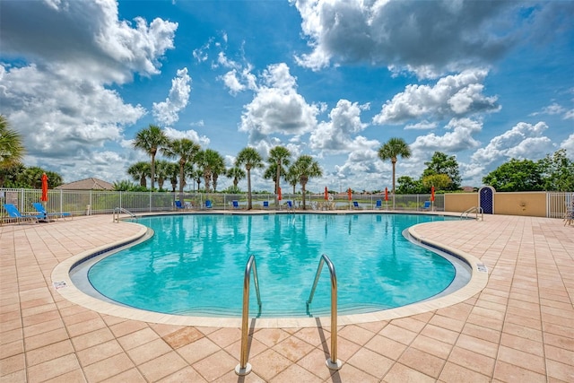 view of swimming pool featuring a patio area