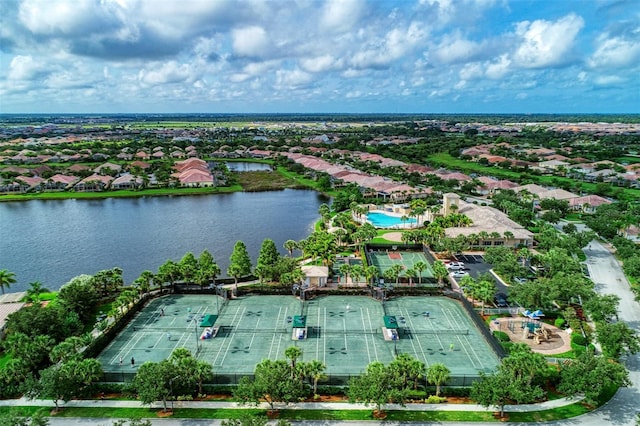 drone / aerial view featuring a water view and a residential view