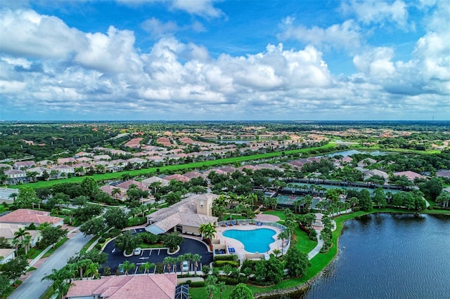 drone / aerial view with a residential view and a water view