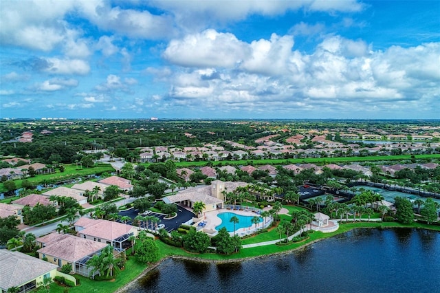 drone / aerial view with a water view and a residential view