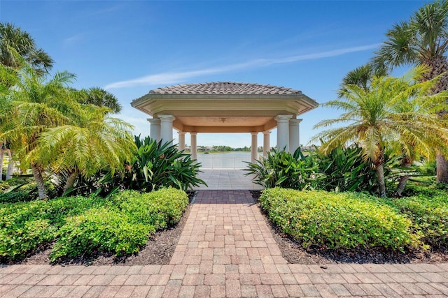 view of community featuring a garage and a water view