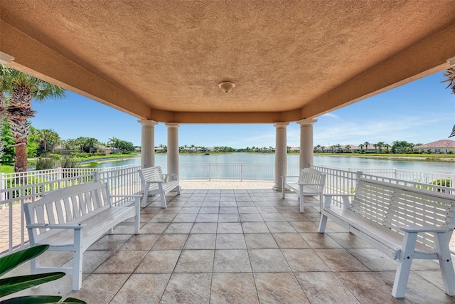 view of patio featuring a water view