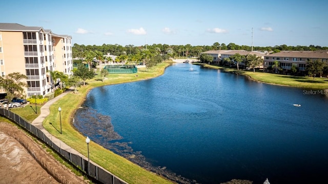 view of water feature with fence