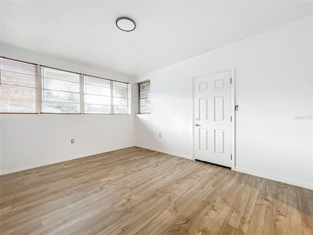 spare room featuring light wood-type flooring