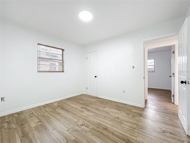 unfurnished room featuring light wood-type flooring