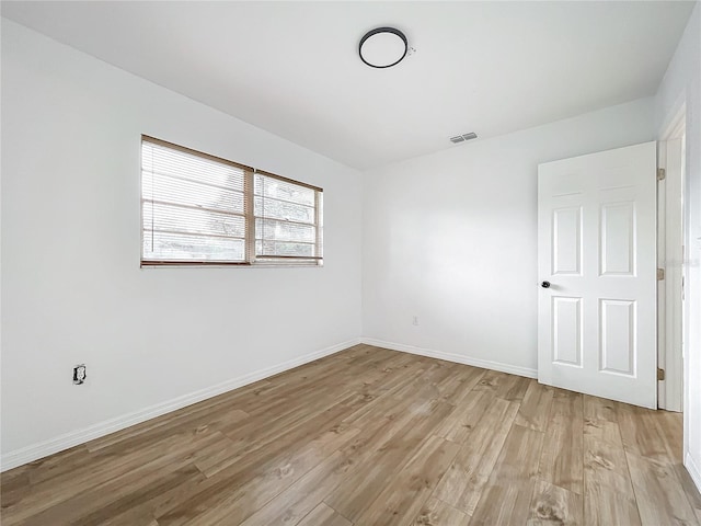 empty room featuring light hardwood / wood-style floors